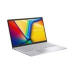 Sleek Cool Silver ASUS Vivobook 15 X1504VA-NJ2324WS shown at a dynamic angle, highlighting its thin chassis, the ASUS logo on the lid, and a view of the keyboard deck