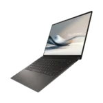 ASUS Zenbook S 14 OLED UX5406SA laptop in dark gray, angled view showing slim profile, backlit keyboard, and 14-inch display.