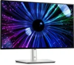 Dell UltraSharp 24 U2424HE monitor with vibrant abstract eye display and silver stand.