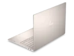 HP OmniBook Ultra laptop in Silk Sand with HP logo, showing keyboard and ports.