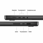 Close-up of MacBook Pro ports: MagSafe, Thunderbolt 5, headphone jack, SDXC, and HDMI.