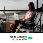 Woman using a 14-inch Apple MacBook Pro M5 Pro with 24GB RAM and 2TB SSD in Space Black at an airport.