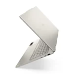 Lenovo Yoga 7 2-in-1 laptop in a light metallic finish with a visible keyboard and trackpad.