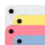 Stacked Apple iPad A16 tablets in white, yellow, pink, and blue finishes, showcasing the rear camera and sleek design.