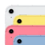 Stacked Apple iPad (A16) tablets in white, yellow, pink, and blue showing rear camera modules at YourShoppy.com in Bangalore.