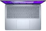 Top-down view of an Ice Blue Dell 14 Plus laptop featuring a backlit keyboard and touchpad at YourShoppy.com.