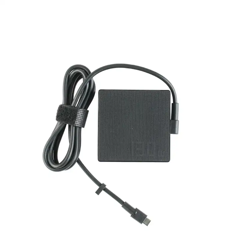 ASUS 130W USB-C power adapter for ROG Flow and Zenbook A16 laptops, featuring a black square charging brick and attached cabl