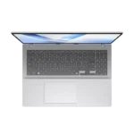Top-down view of the silver ASUS Vivobook 16 X1607QA-MB188WS laptop featuring a full-size keyboard and spacious trackpad.