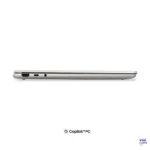 Side profile of the thin Seashell Lenovo Yoga 7 2-in-1 14IPH11 laptop showing ports and Intel Core Ultra branding.