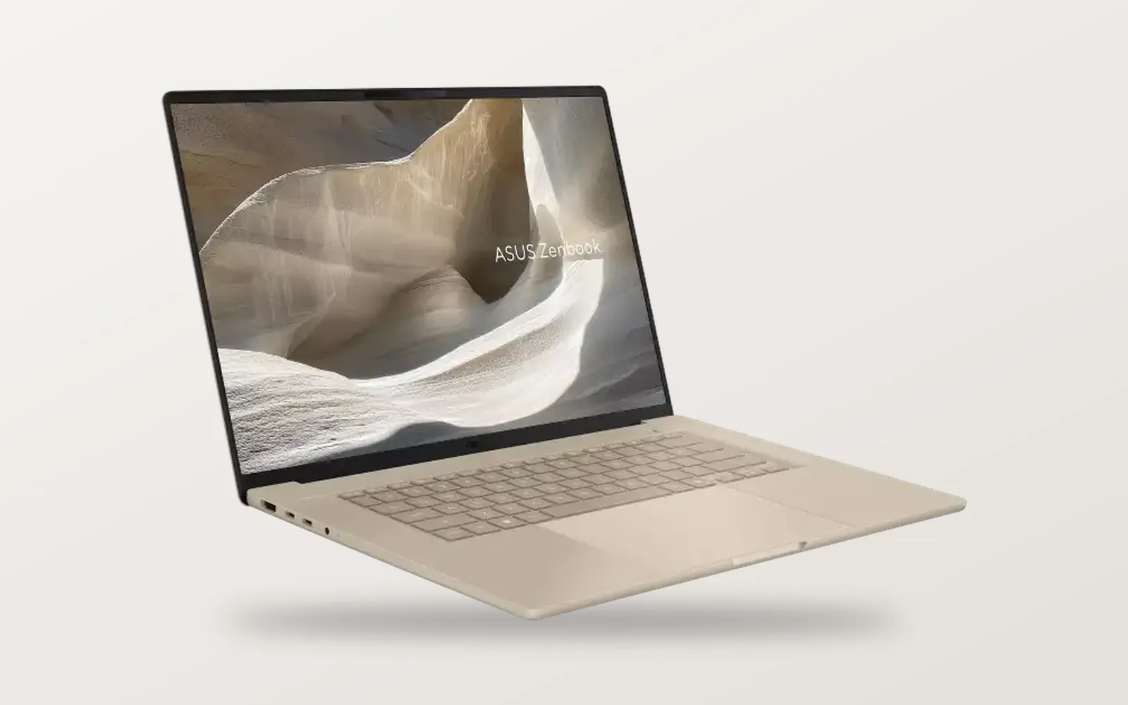 ASUS Zenbook A16 in Zabriskie Beige, open at an angle