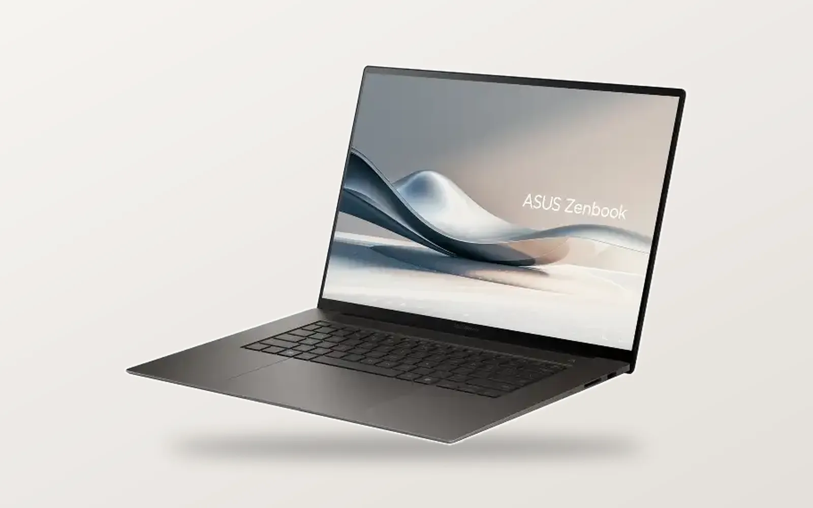 ASUS Zenbook S 16 in Zumaia Gray, open at an angle
